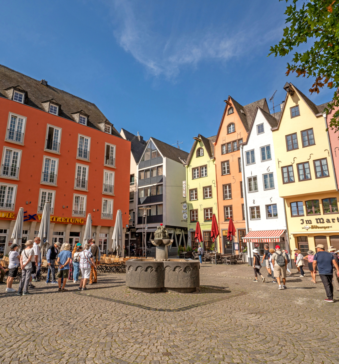 Colourfully painted buildings in Cologne square