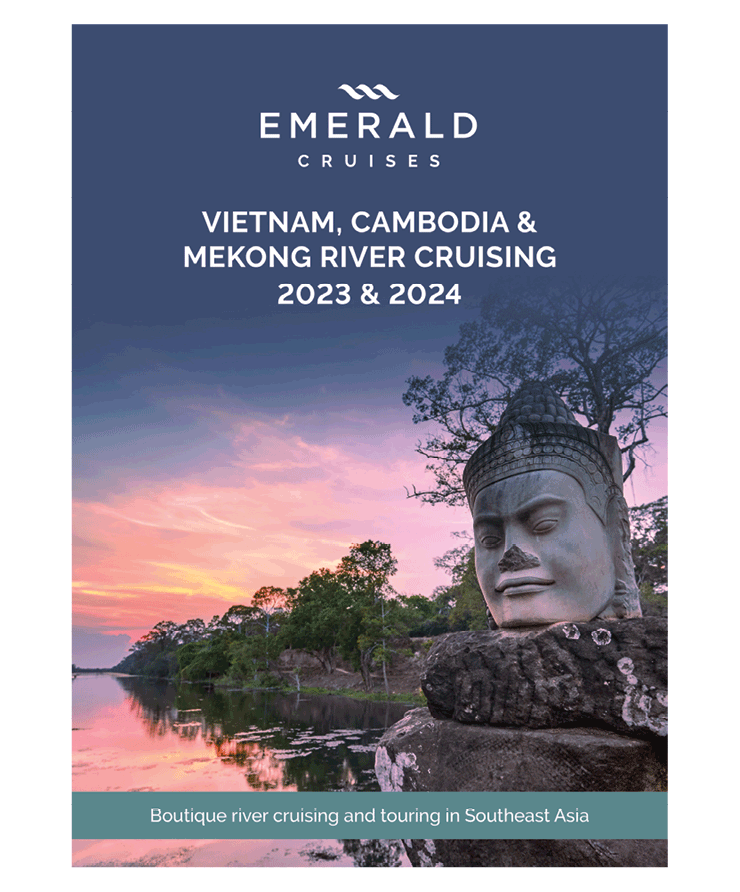 A luxury river cruise brochure, featuring a religious statue near the banks as the sun sets over the Mekong 