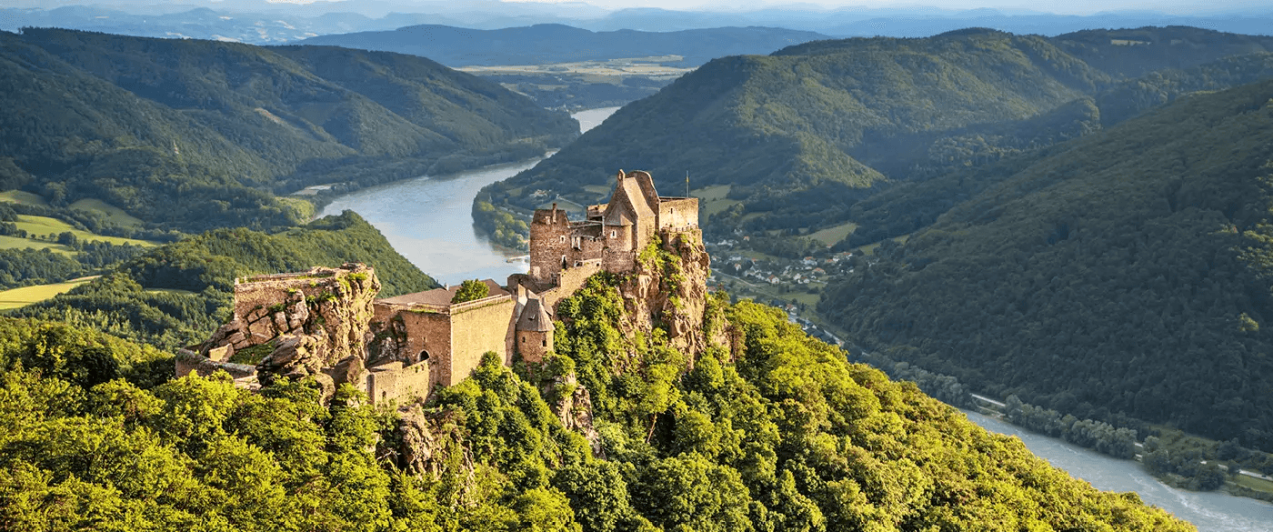 Durnstein Castle atop of a green hill in the Wachau Valley of Austria, near the banks of the Danube River