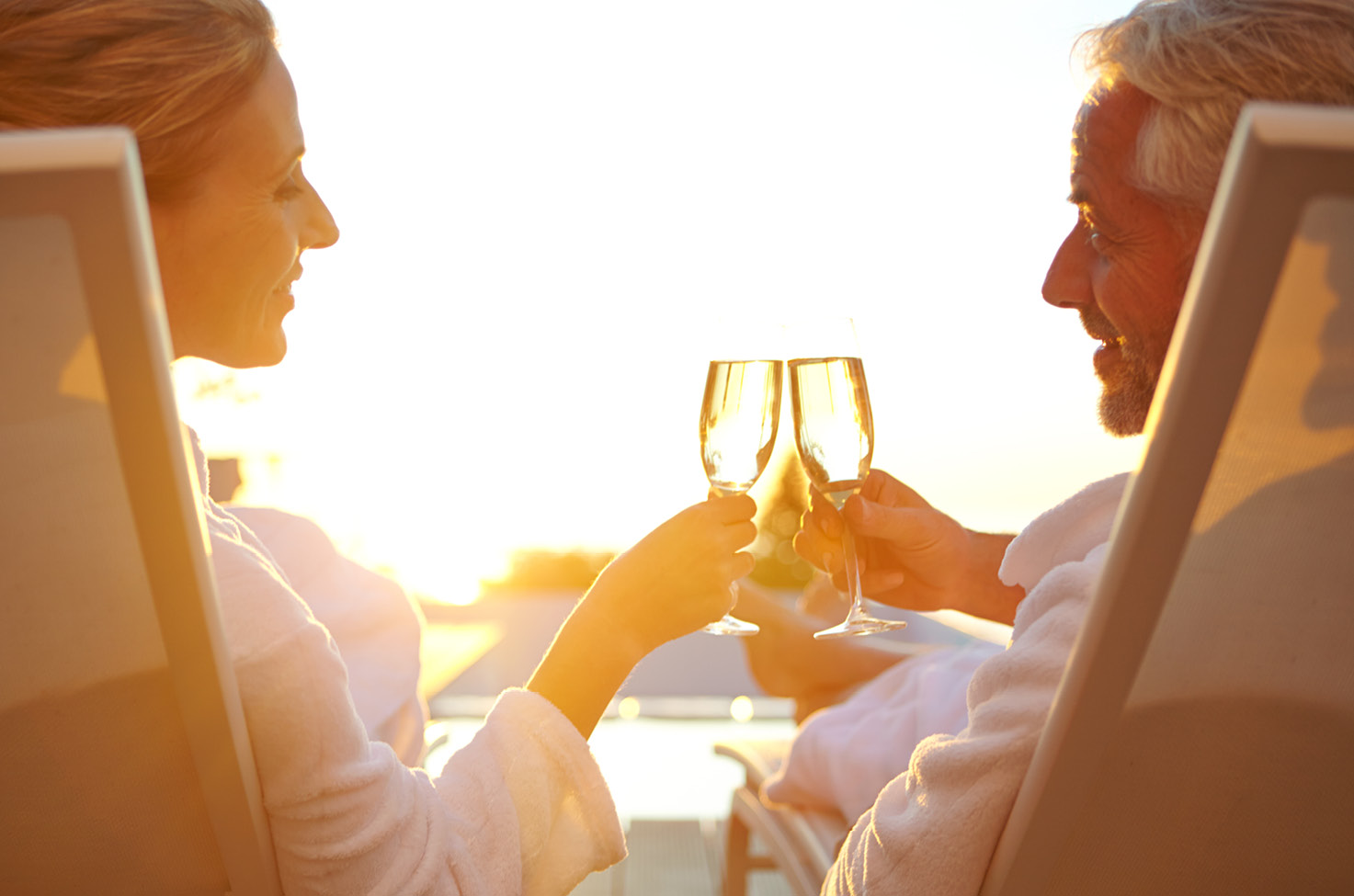 Couple enjoying their drinks near a pool on Emerald luxury yacht