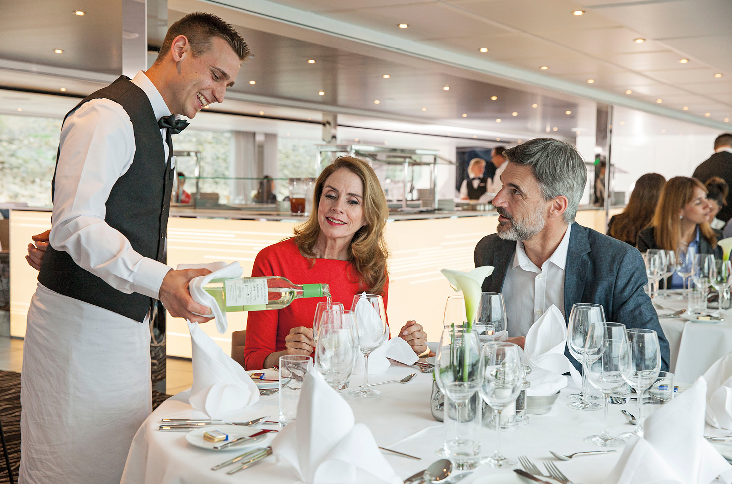 Couple fine dining on board a luxury Europe river ship  