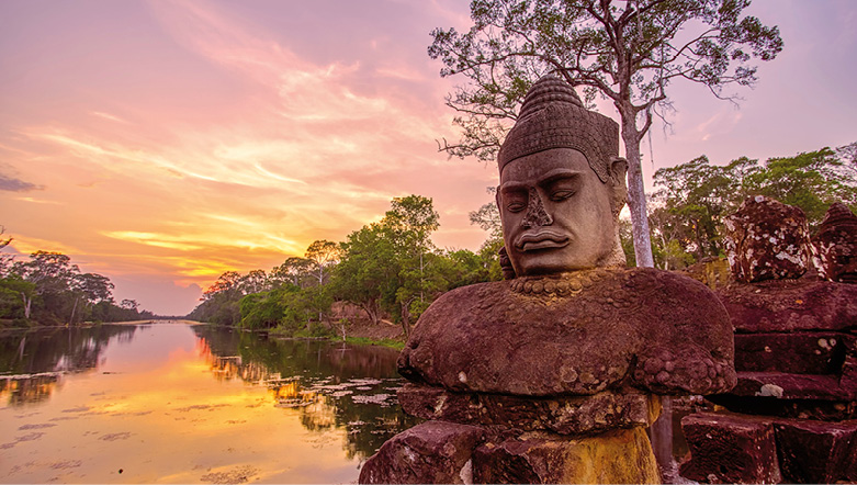 Ancient monument at sunset near the riverbed outside of Angkor Thom in Siem Reap, Cambodia