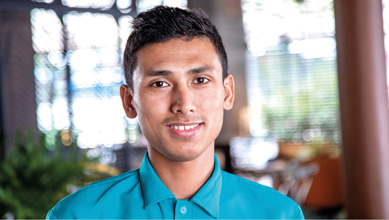 Member of staff on board a luxury river ship in Southeast Asia