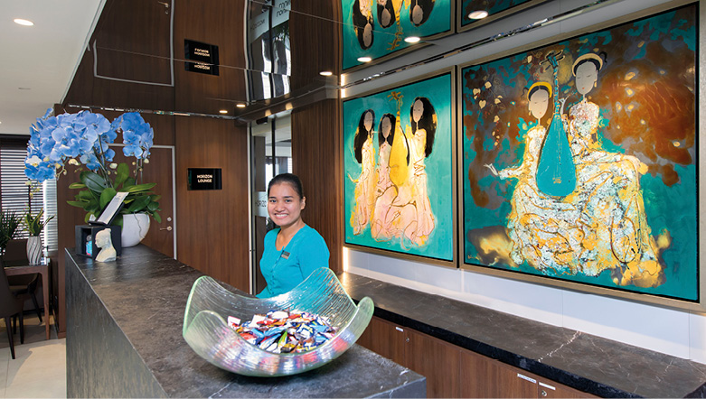 Team member at the Reception area on board a luxury river ship in Southeast Asia