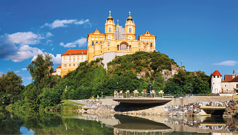 Austria's Melk Abbey buliding sitting on a rocky outcrop overlooking the Danube river
