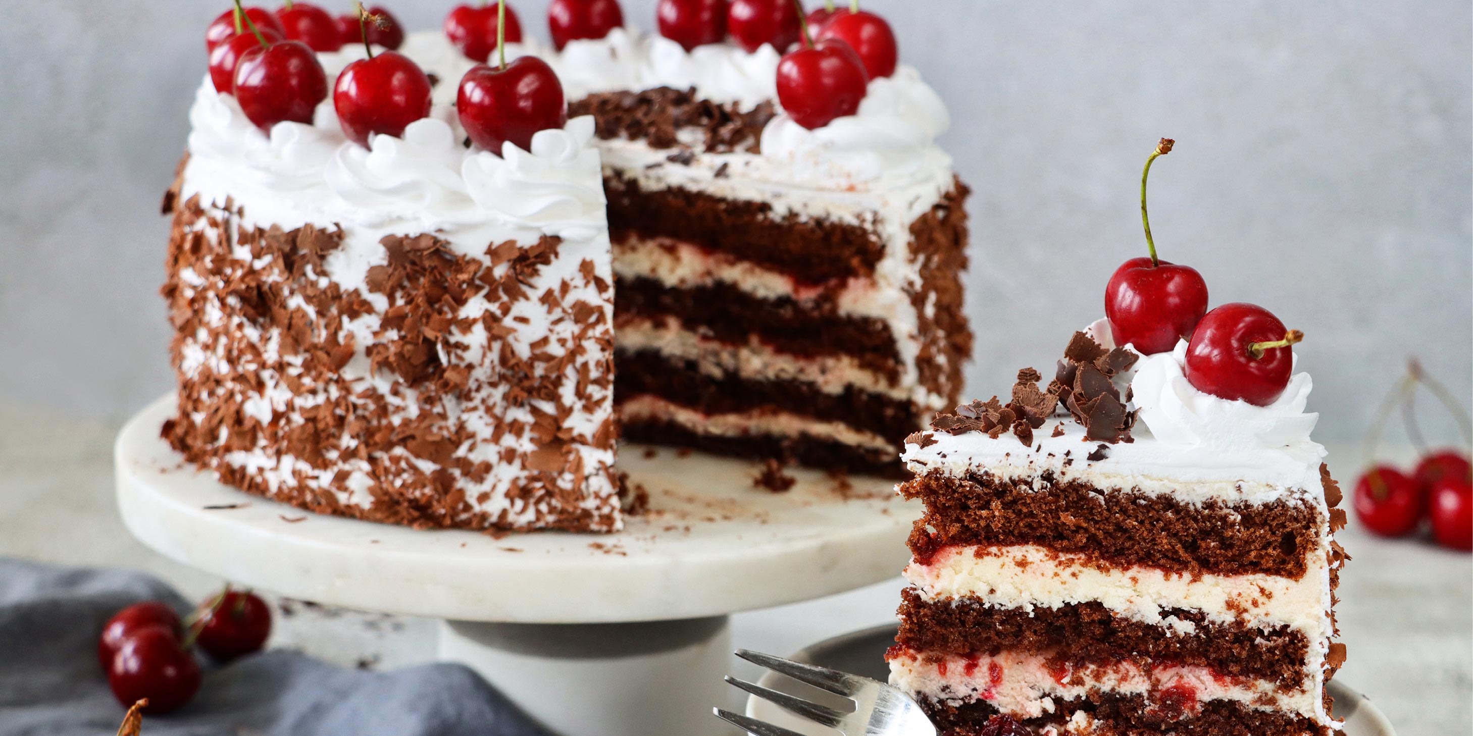 A slice of German Black Forest gateaux with cherries on top