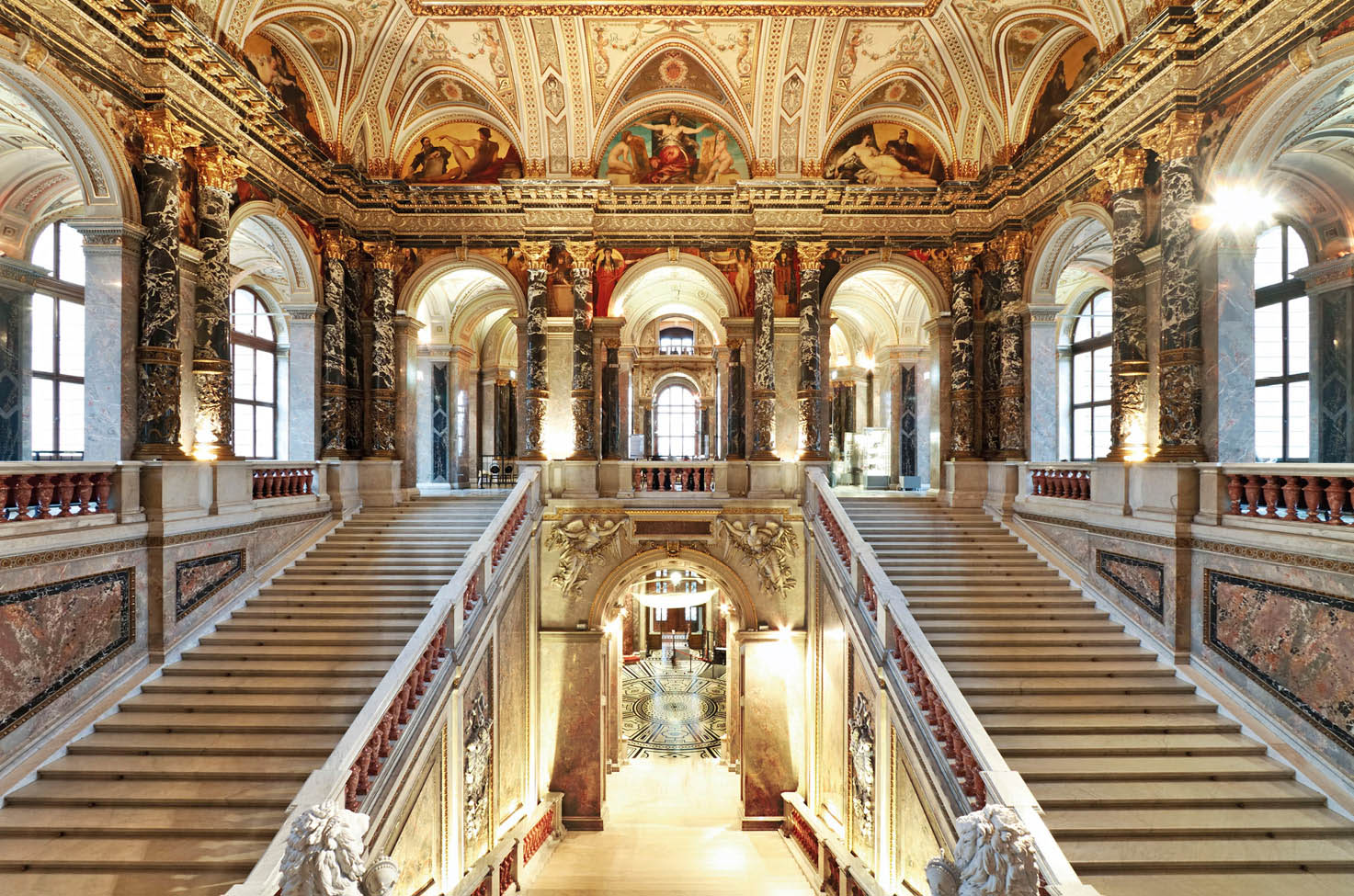 The grand staircases, archways, and ceiling of Kunsthistorisches Museum located in Vienna, Austria