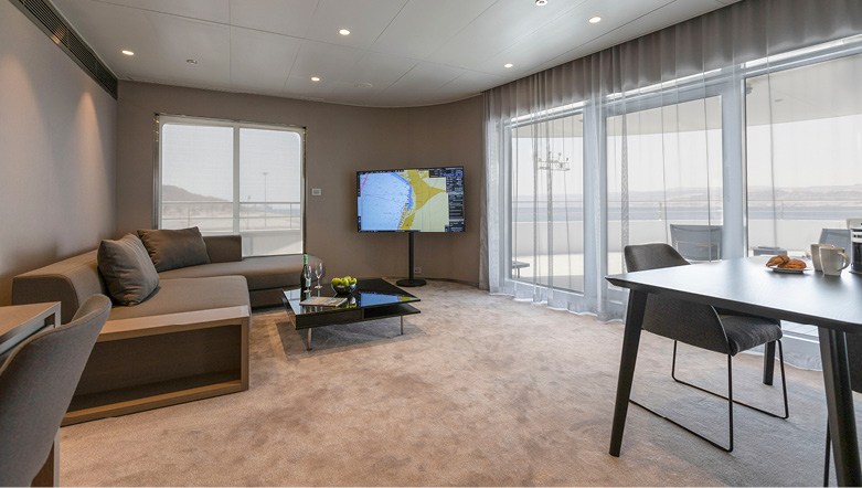 A large and spacious separate lounge in the top cabin grade on board an Emerald Cruises yacht