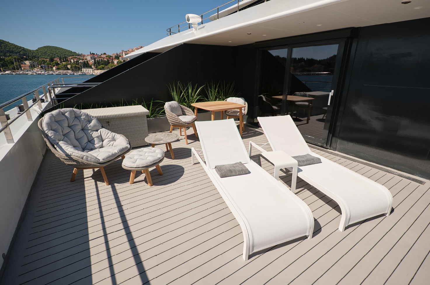 Seating area with a delicious breakfast of fresh coffee and pastries served on the terrace on a luxury Emerald Cruise yacht