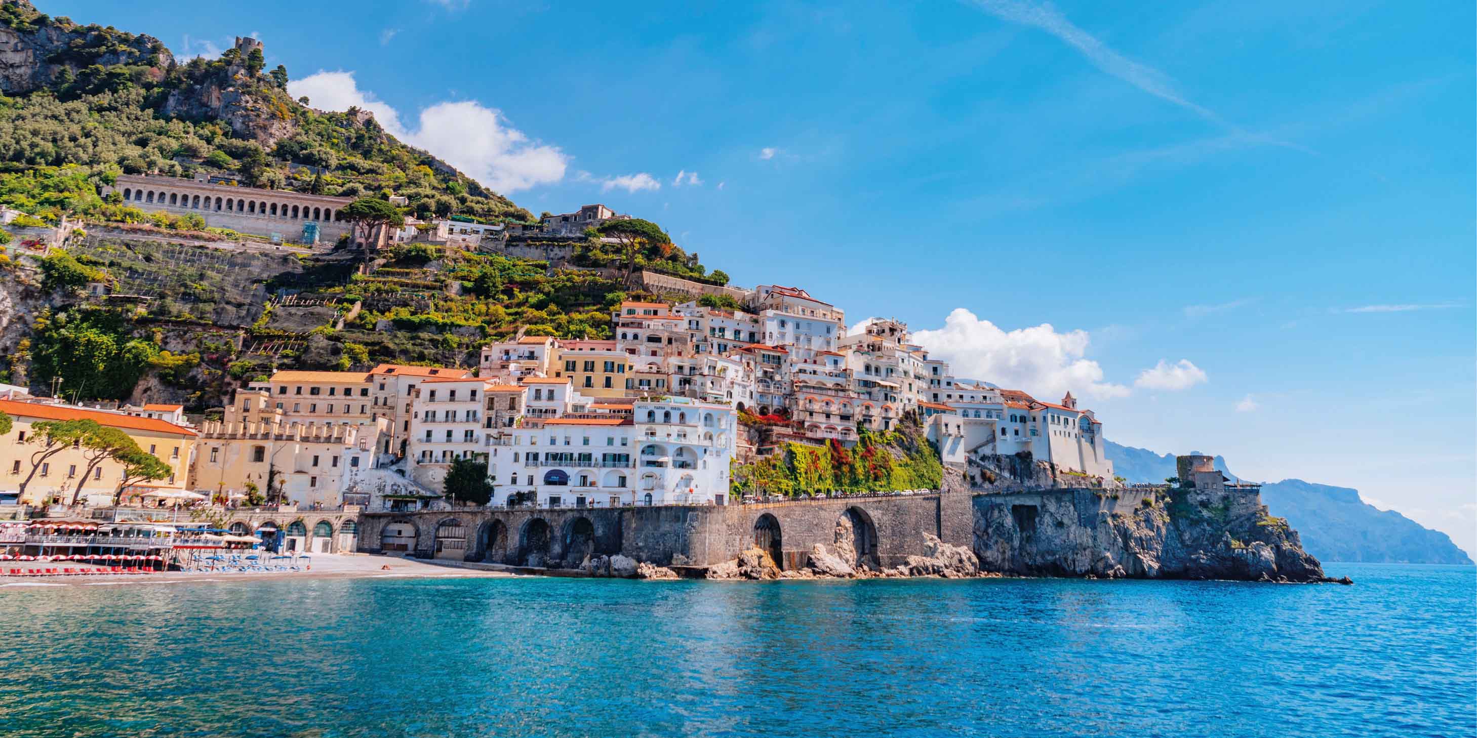 The stunning coastline of the Amalfi Coast, with traditional houses built up against the cliff edge